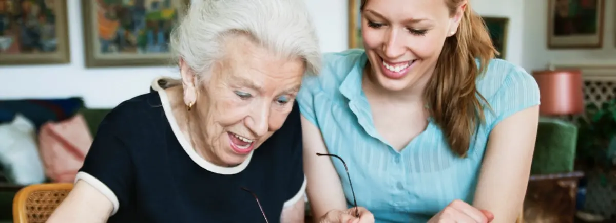A SYNERGY HomeCare caregiver providing companionship to a senior at home